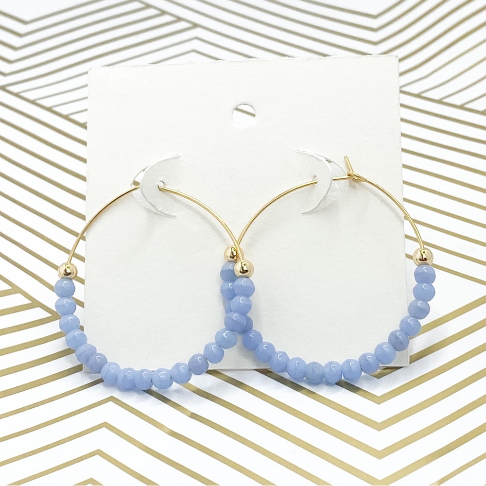 Gold beaded hoops light blue earrings